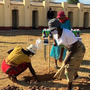 Women take the lead in helping set up 'Tip-It-Taps' at Dakamela Primary School, in preparation for the re-opening of schools