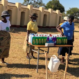 Members of the Rural Women's Assembly, help in handing over sanitizers at Dakamela Primary School