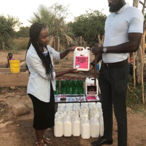 The youthful chief Dakamela receives sanitizers to be be used in the local traditional court.